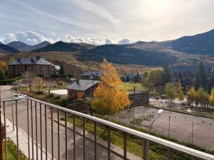 a view from a balcony of a town with mountains at Doble balcón, máxima luz- Confort de qualidad - Erta 5 in Pla de l'Ermita