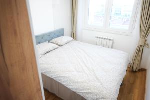 Postel nebo postele na pokoji v ubytování Apartment Lumora