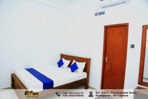 Postel nebo postele na pokoji v ubytování Moon Town