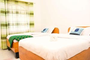 Ένα ή περισσότερα κρεβάτια σε δωμάτιο στο Eldoville Home