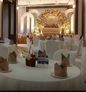 a table with white chairs and bottles of water on it at Himalayan Gateway By Dept Of Tourism, GTA in Jāmb +34 photos