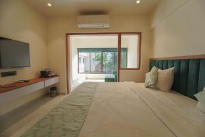 Postel nebo postele na pokoji v ubytování Star Regency Resort & Spa