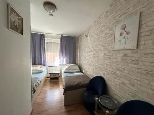 Postel nebo postele na pokoji v ubytování Hotel Wysoka Brama