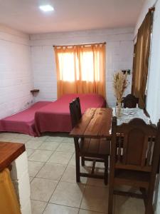 Ένα ή περισσότερα κρεβάτια σε δωμάτιο στο Cabañas El Nogal