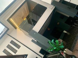 an overhead view of a kitchen with a window and a plant at Eperorsuits in Ikot Omin