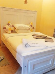 Ένα ή περισσότερα κρεβάτια σε δωμάτιο στο Villa Serene hotel