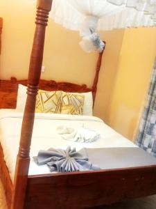 Ένα ή περισσότερα κρεβάτια σε δωμάτιο στο Villa Serene hotel