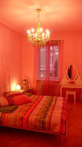 
A bed or beds in a room at B&B La Vie en Rose
