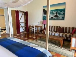 Ένα ή περισσότερα κρεβάτια σε δωμάτιο στο Chez Olivier - Île de Gorée