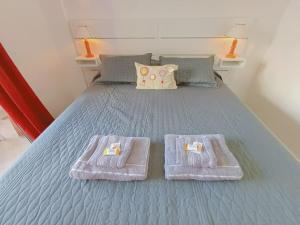 En eller flere senge i et værelse på Departamento con Pileta en Pleno Centro