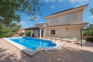 a villa with a swimming pool and a house at Your Island Villa Son Serra in Son Serra de Marina