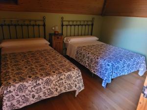 Postel nebo postele na pokoji v ubytování El Encinar