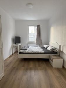 Postel nebo postele na pokoji v ubytování Wupper Apartments Vogel