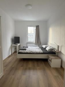 Postel nebo postele na pokoji v ubytování Wupper Apartments Vogel + 6 fotografií