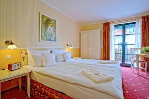 Postel nebo postele na pokoji v ubytování Hotel Godewind
