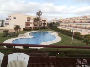 a view of a swimming pool from a balcony of a apartment at Vistamar - Inalko in Alcossebre