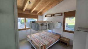 Ένα ή περισσότερα κρεβάτια σε δωμάτιο στο LAAX Homes-Casa Joerger