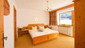 Ένα ή περισσότερα κρεβάτια σε δωμάτιο στο Top Tirol Appartement +18 φωτογραφίες