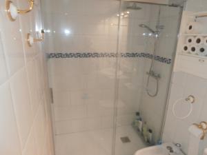 a bathroom with a shower with a toilet and a sink at Vistamar - Inalko in Alcossebre +7 photos