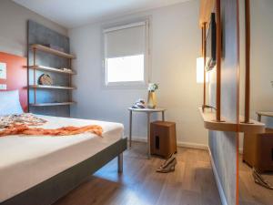 Postel nebo postele na pokoji v ubytování ibis budget Nice Californie Lenval + 128 fotografií