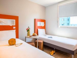 Postel nebo postele na pokoji v ubytování ibis budget Nice Californie Lenval + 128 fotografií