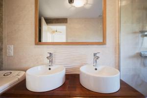 a bathroom with two sinks and a mirror at Gite en Brocéliande avec vue in Néant-sur-Yvel +23 photos