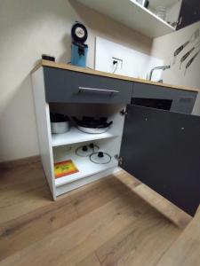a kitchen with a sink and a stove at Le domaine de Fillette in Einvaux