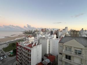 a view of a city with the ocean and buildings at Stuart's Apartment in Mar del Plata