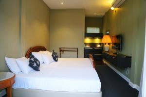 Postel nebo postele na pokoji v ubytování Donald Mansion + 19 fotografií