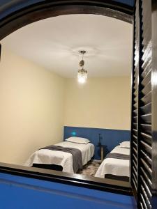 Ένα ή περισσότερα κρεβάτια σε δωμάτιο στο Casa entre Serras