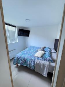 Ένα ή περισσότερα κρεβάτια σε δωμάτιο στο Condominio Anggie