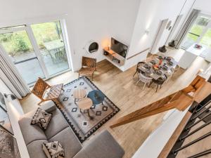 an overhead view of a living room and dining room at Holiday Home Sonnenpfad by Interhome in Lembruch +22 photos