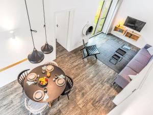 an overhead view of a dining room and living room at Holiday Home Windlicht by Interhome in Lembruch +20 photos