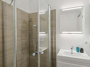 a bathroom with a shower and a sink at Apartment Imort by Interhome in Lembruch