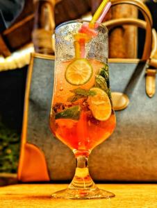 a drink in a glass sitting on a table at Elma Suites and Lounge in Kampala