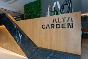 a sign for aarma garden at a store at Alta Garden Housi João Pessoa by Carpediem in João Pessoa