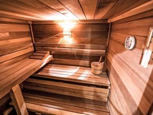 an empty sauna with a clock on the wall at Holiday Home Bio-Landhaus Kesslerhof-6 by Interhome in Moosheim