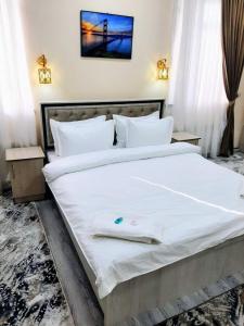 Postel nebo postele na pokoji v ubytování Chempion Hotel