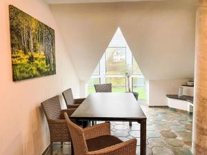 a dining room with a table and chairs at Holiday Home Naturnah mit Pool und Sauna by Interhome in Waldau