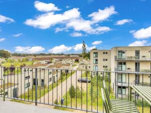 an apartment balcony with a view of buildings at Apartment Seeflair by Interhome in Lembruch