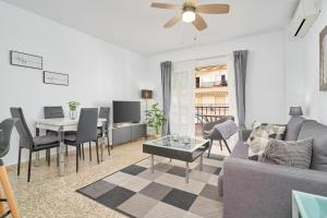 a living room with a couch and a table at Albaida 3G Nerja in Nerja