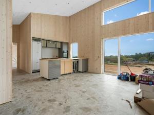 an empty kitchen in a house with large windows at Holiday Home Gillis - 1km from the sea by Interhome in Tvedhuse