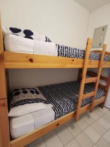 two bunk beds in a small room with at Studio Ciel d'Azur - 4 pers - Fréjus Plage - Tout à pied in Fréjus