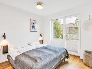 Ένα ή περισσότερα κρεβάτια σε δωμάτιο στο Apartment Seegold by Interhome