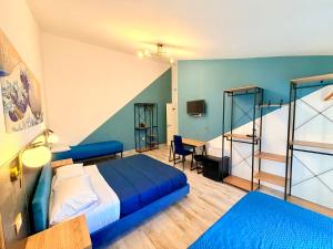 a hotel room with a bed and a desk at Nautilus B&B in Scalea