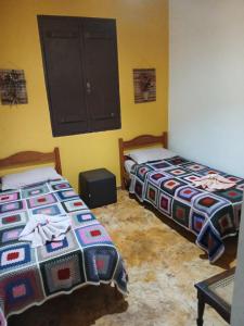 Postel nebo postele na pokoji v ubytování Mini Casarão