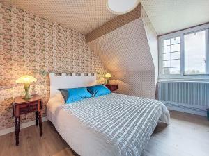 Ένα ή περισσότερα κρεβάτια σε δωμάτιο στο Holiday Home Les Goganes by Interhome