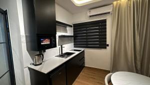 Cuina o zona de cuina de Suite 408 - Luxe & Confort 9 fotos més