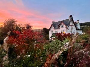 a house on top of a hill with trees at Room 1, Wedale House in Stow
