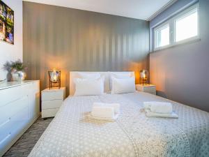 Postel nebo postele na pokoji v ubytování Apartment Bella by Interhome